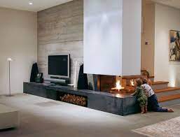Avant Garde Stoves Enchant Living Spaces In Luxurious Highlights Gt Chamber Of Idee Camino Arredamento Salotto Con Camino Arredamento Sala Con Camino