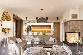 If you are trying to achieve a stunning scandinavian look in your living room, learn the top 10 interior design tips and ideas that i share in this video. Living Room And Kitchen Interior Design With Fireplace Modern Stock Photo Picture And Royalty Free Image Image 105579506