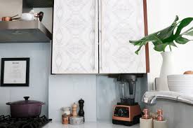 kitchen cabinets with wallpaper