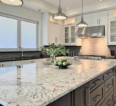 This beautiful white kitchen remodel was done using everest white quartz countertops, gray subway tiles for the backsplash, white cabinets. Everest White Granite From Omni Surfaces Corporation Facebook