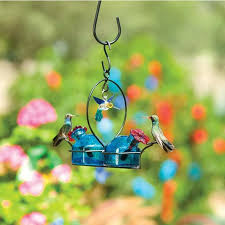 This hummingbird feeder takes multiple items you might otherwise toss and recycles them into an hang it upside down from a tree, and you have a beautiful upcycled hummingbird feeder. Parasol Bouquet 2 Deluxe Hummingbird Feeder Backyard Bird Centre