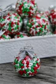 Make wreath ornaments with your child this holiday season. How To Make Christmas Candy Filled Ornaments Tonya Staab Christmas Favors Christmas Party Favors Christmas