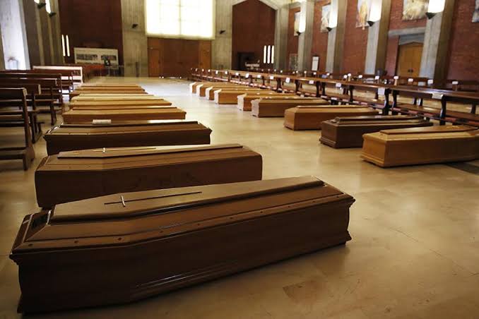 Coffins staged in Bergamo churches before military transit, AI generated