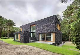Browse modern, brick, cottage, rock exterior, cabin & more stone home designs! Stone House Siding Blends Beautifully With Nature In The Netherlands