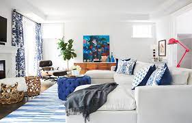 The wall unit, console and armchair each give character to the room, and the textures offer a warming color too. These 70 Rooms Prove A Pop Of Color Is All You Need House Home