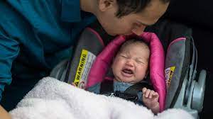 How To Comfort A Crying Baby In The Car Mom Com