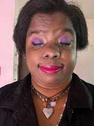 Soft glam makeup look with glossy lips and matte wings