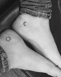 Tattoo A Sun And A Moon Jonboy Tattoo Small Foot Tattoos Tiny Tattoos