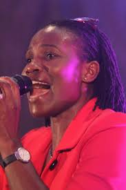 When she sings, everyone says 'Amen'. What is the name of this gospel  singer who looks like a HR manager at MTC?