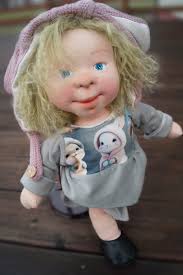 12-inch doll with painted shoes and yarn hair