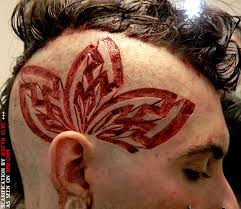 Scarification is done either by cutting repeatedly with a scalpel, using a cauterizing tool, or by strike branding, which is much like cattle branding. Facial Scarification Bme Tattoo Piercing And Body Modification News Page 2