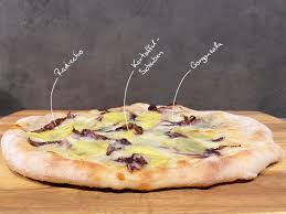 Combine flour, ½ teaspoon salt, sugar, and yeast in the bowl of an electric mixer, and slowly add 1 cup cold water. Pizza Bianca Mit Kartoffeln Radicchio Und Gorgonzola