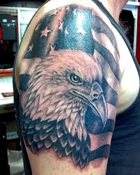 There is an eagle, which is sitting on a blooming blue rose, the american flag is. Eagle Flag Arm Tattoo Arm Tattoo Sites