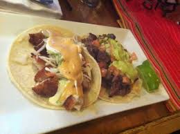 Fried fish, corn tortillas, shredded cabbage, salsa, crema: Fish Taco And Caramelo Taco Picture Of El Centro Mexican Restaurant Boston Tripadvisor
