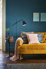 Colors used with yellow in this room: Blue Living Room Yellow Sofa Essentialrealestatelist Com