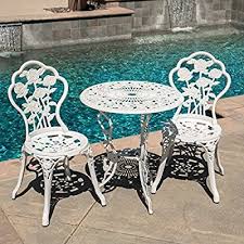 To enhance the look, place the table under a pergola and add patio shades to increase comfort while you enjoy dinner al fresco. Amazon Com Belleze Bistro Outdoor 3 Piece Patio Set Rose Design Weather Resistant Round Table 2 Chairs White Cast 3 Piece Patio Set Bistro Outdoor Bistro Set