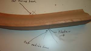 If the cabinets are all 12 deep, you will have to use a piece of filler and return the crown molding back at a 22.5 degree angle to prevent issues with the door opening of the diagonal corner wall cabinet. Installing Radius Crown Molding
