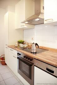 Your modern wood kitchen cabinets stock images are ready. Wood On White With Drop In Range Kitchen Design Small White Modern Kitchen Modern Kitchen Cabinets