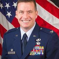 Command Sgt. Maj. Alexander Poutou recites the NCO