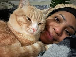 Cat owner with four cats joins group