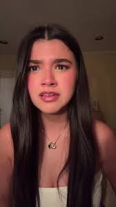 Brooke behind Dumpster