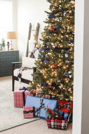 When choosing the decor for your own red is a basic staple for traditional christmas tree decorating, but it has starting with a very simple illuminated star at the top, the tree features a selection of violet ornaments that flow into blue. Blue Red Christmas Home Tour Part 2 Delightfully Noted