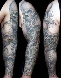 Black and white skull with tribal design tattoo sample. 50 Skull Sleeve Tattoos For Men Masculine Design Ideas