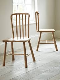 Some have no back rest and can be sat on from either si Two Bergen Oak Dining Chairs Natural
