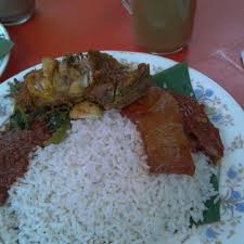 Nasi lemak is a common breakfast dish, sold early in the morning at roadside stalls in malaysia, where it is often sold packed in newspaper, brown paper or banana leaf. Nasi Lemak Kampung Baru Kampung Bahru 7 Tips