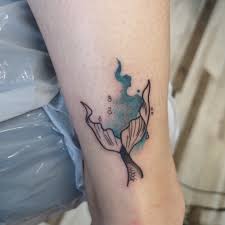 The internet has a variety of beautiful mermaid tattoos for your enjoyment. Small Mermaid Tail Done By Emporium Tattoo Piercing Facebook