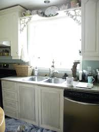 Grey kitchen cabinets against light wood floor. Maison Decor Kitchen Cabs Get A Grey Chalk Wash