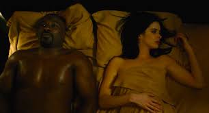 Luke (Mike Colter) and Jessica (Krysten Ritter) in AKA It's Called Whiskey  