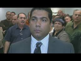 Peter Peraza receives support as he enters not guilty plea