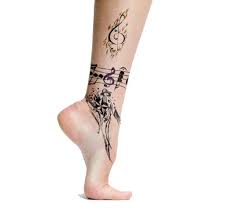 30 Magnificent Music Tattoo Designs Collection Sheplanet Music Tattoo Designs Music Tattoos Music Tattoos For Women