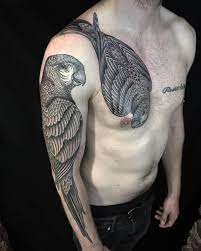 Parrot tattoos and their unique meanings. Parrot Tattoos On Chest And Arm