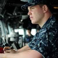 Ensign Robert Wynne stands watch in the pilot house