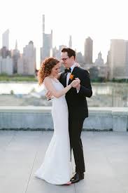 When you need a stunning dress for a wedding or other special occasion, keep things simple and elegant with a long evening gown. Modern Couple Wearing Simple Wedding Dress And Black Tuxedo