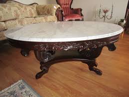 The smooth faux marble table top, paired with clean lines, creates a crisp look. Oval Marble Top Wood Coffee Table Ornate Carved Design Floral Motif Victorian Style Online Auctions Proxibid
