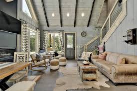 The adjoining living room space space features a guest bathroom and spacious seating area including a sofa bed and fully equipped kitchenette. Oakley S Mountain Modern Lodge Mountain Modern Lodges