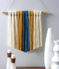 The latest bohemian decor trend has brought with it the return of macramé. Yarn Wall Hanging On A Budget In A Few Easy Steps Diy Candy