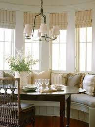 Bay Window Dining Area W Built In Seating Lots Of Cushions Cane Back Chairs Roman Blinds Cozy Kitchen Bay Window Dining Nook Window Seat Kitchen