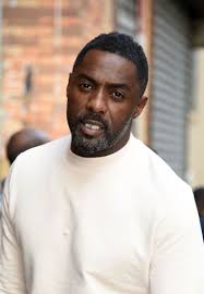 Idris Elba looks great in a white sweater at The Daily Show in New York