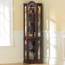 For the best in curio lighting, log onto curiocabinetspot.com. Lighted Corner Curio Cabinet Mahogany Southern Enterprises Cm0696