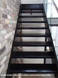 Black Stained Timber Stairs In Wooloowin Brisbane Brisbanes Finest Floors In 2021 Timber Stairs Stained Staircase Stairs