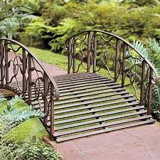 This utterly elegant bridge with delicate, thin metal decorations on the end of each railing. Garden Structures Shade Weathered Black Finish Metal 4 Foot Garden Bridge Outdoor Yard Lawn Landscaping Home Garden