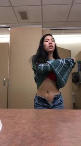 Asian whore strips and masturbates in public restroom