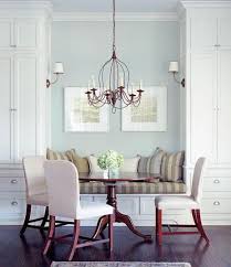 A pink velvet french girl's bed accented with pink and gray bedding and topped with pink and gray pillows sits against tongue and groove trim finishing a gray wall. Built In Banquette Transitional Dining Room