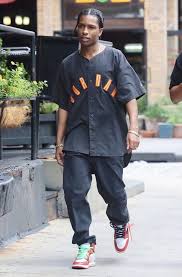 Asap rocky relaxes in gucci pants and scarf, & calvin klein tee Asap Rocky Pause Online Men S Fashion Street Style Fashion News Streetwear