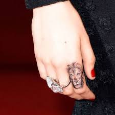 An affinity for finger tattoos. Lion Tattoo On Cara Delevigne S Finger