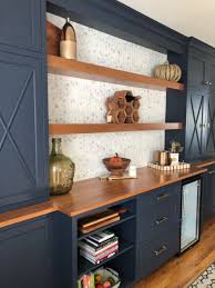 This kitchen has a lot of wood in it, but because the cabinetry color is not a typical wood tone, there's enough Built In Cabinets Wood Countertops Kitchen Kitchen Remodel Wood Kitchen Cabinets